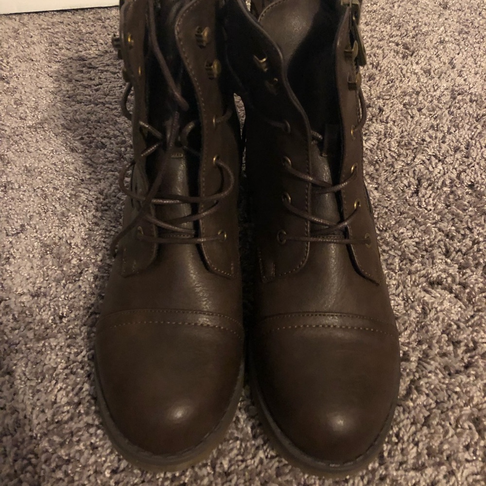 Brown, faux leather ankle boots with side side and laces.